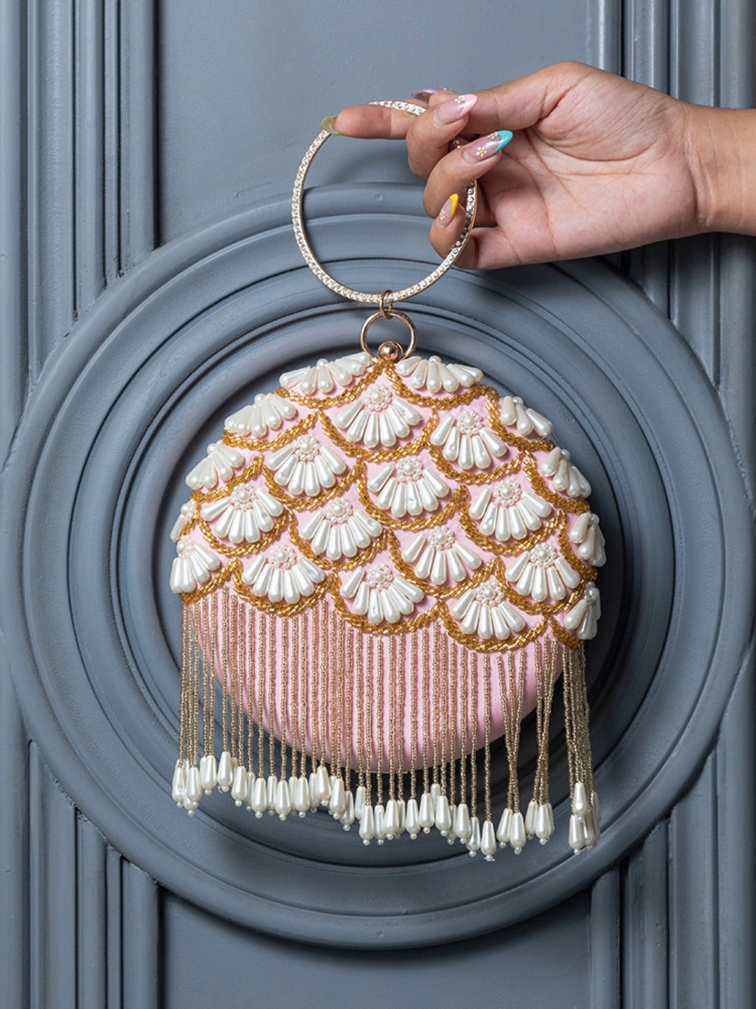 Irsa Round Hand Embroidered Clutch with Tassles